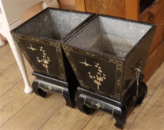 A pair of Chinese style black lacquer planters H.45cm